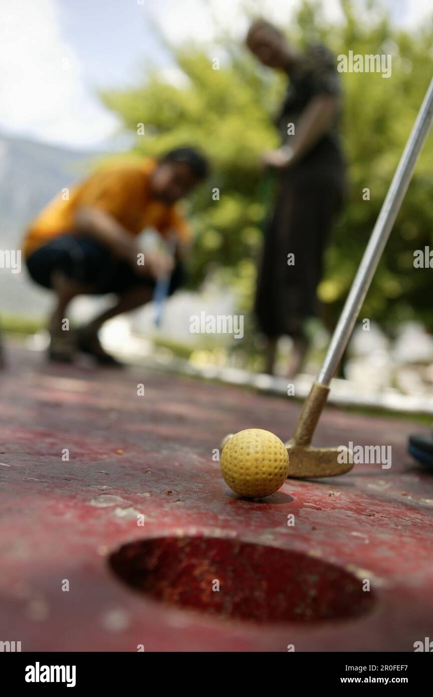 People playing miniature golf, Tyrol, Austria Stock Photo