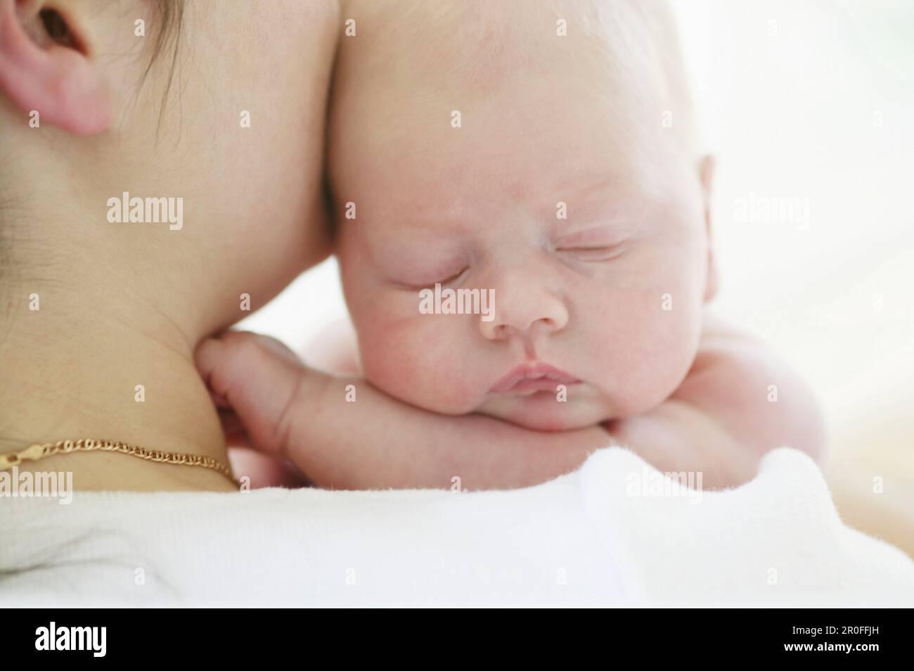 Mother holding baby close hi-res stock photography and images - Alamy