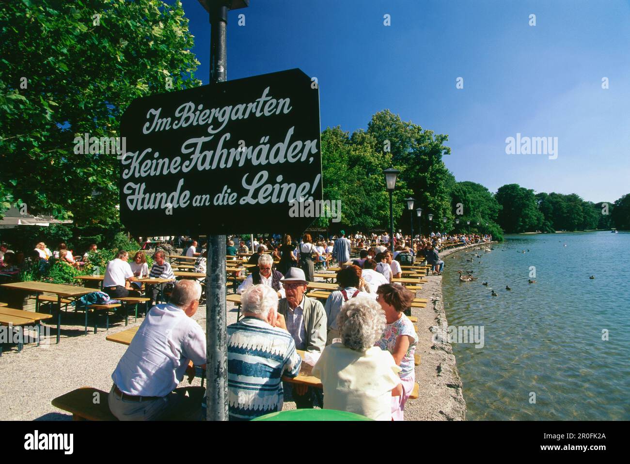 People sitting in beergarden Seehaus, English Garden, Munich, Bavaria, Germany Stock Photo