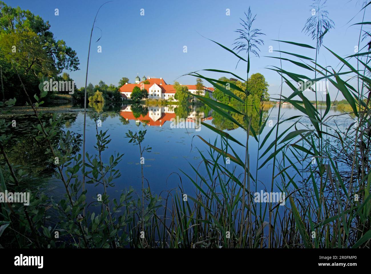 Seeon Abbey in Lake Seeon, Chiemgau, Upper Bavaria, Bavaria, Germany Stock Photo