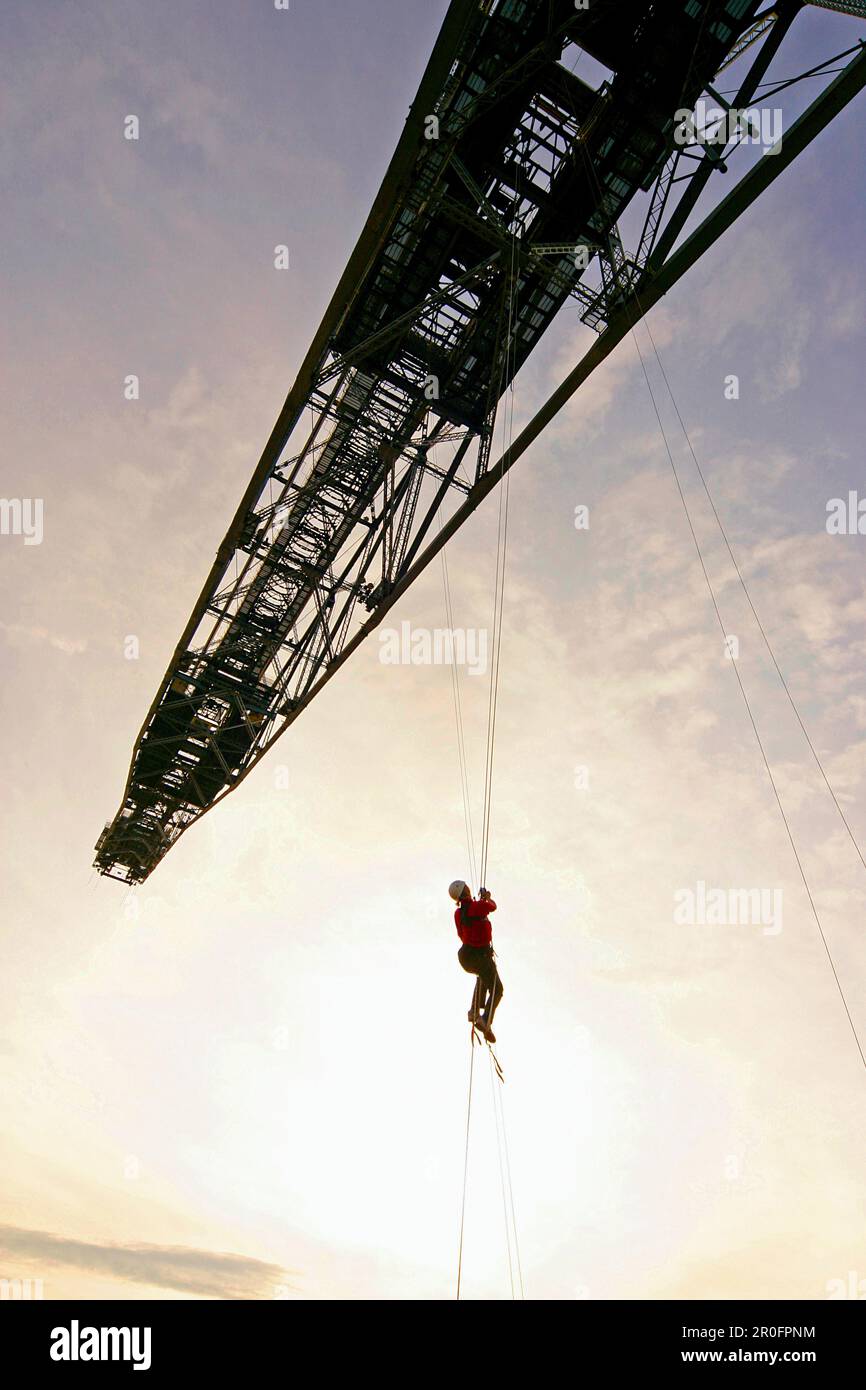 Person climbing on an overburden conveyor bridge F 60, Mining Exhibition, Lichterfeld, Brandenburg, Germany Stock Photo