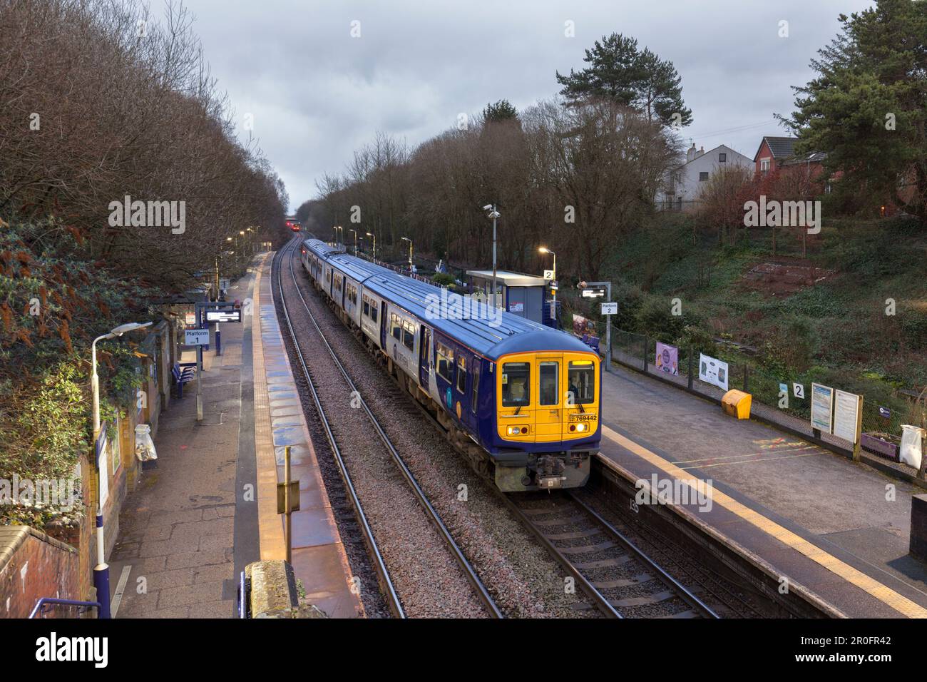 Northern Rail class 769 bi mode flex train 769442 calling at Hindley