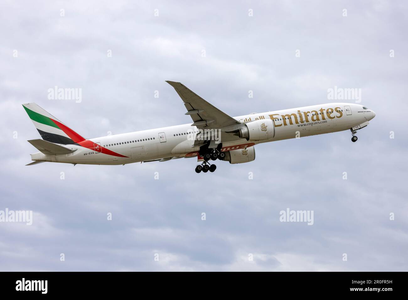 Emirates Boeing 777-31H-ER (REG: A6-EGQ) on take off from runway 13. Stock Photo