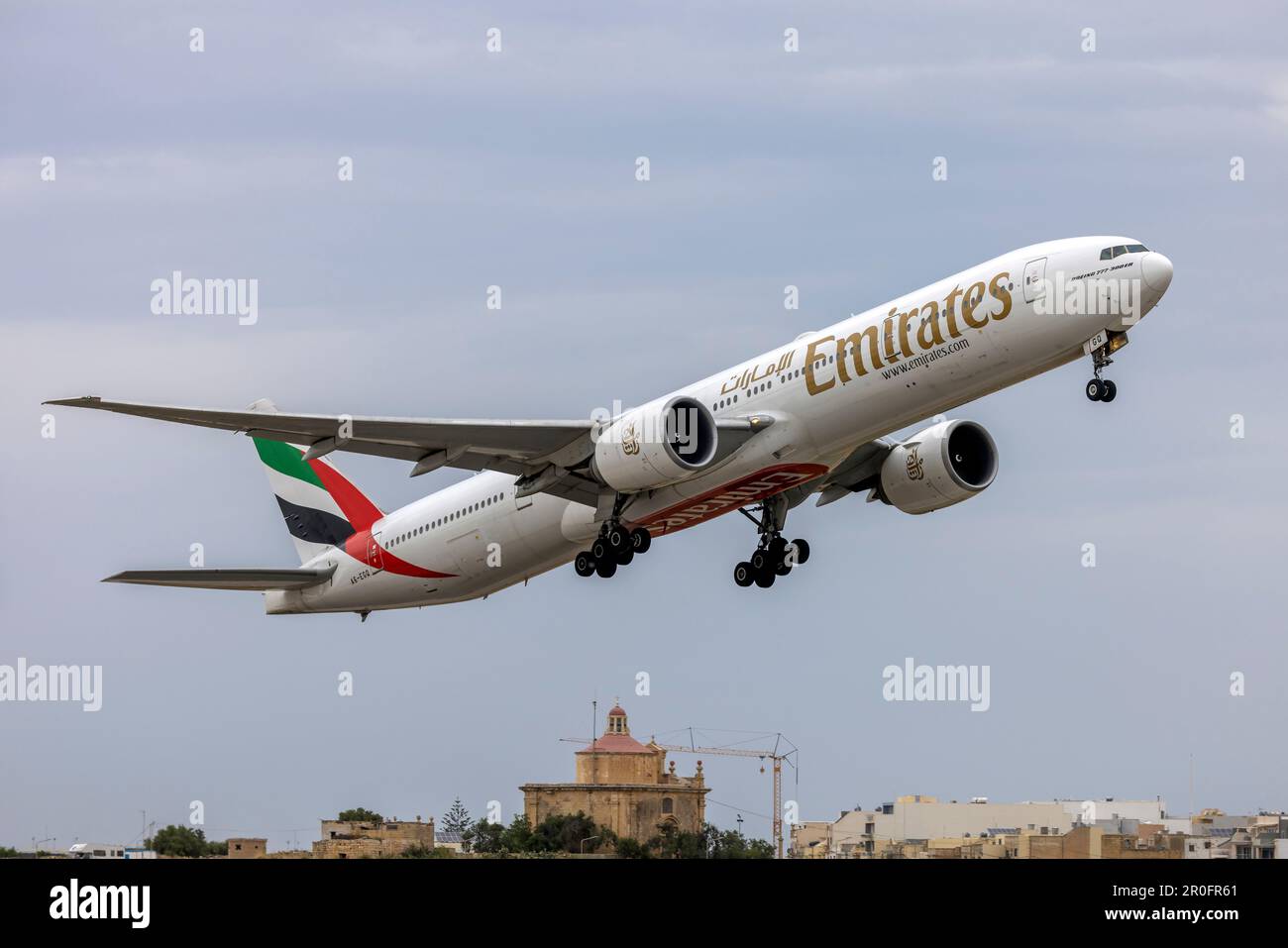 Emirates Boeing 777-31H-ER (REG: A6-EGQ) on take off from runway 13. Stock Photo