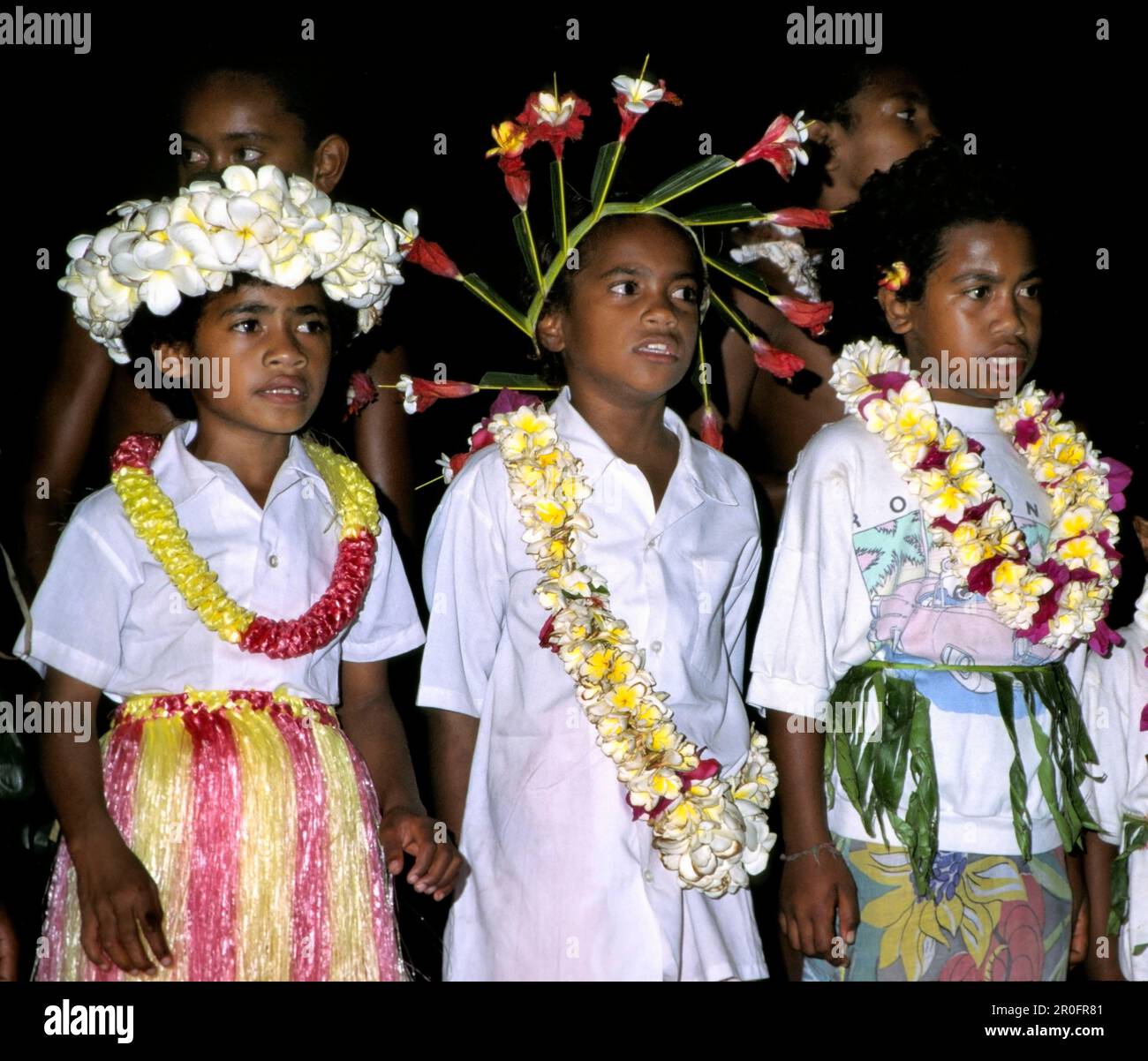 south pacific  Fiji Vitu Levu Nananu I Ra school boys in ceremonial dresses with flowers Stock Photo