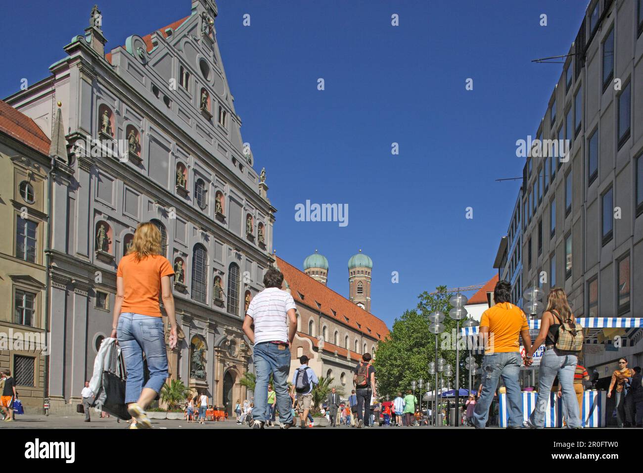 People going shopping at the pedestrian area Neuhauser Strasse with the ...