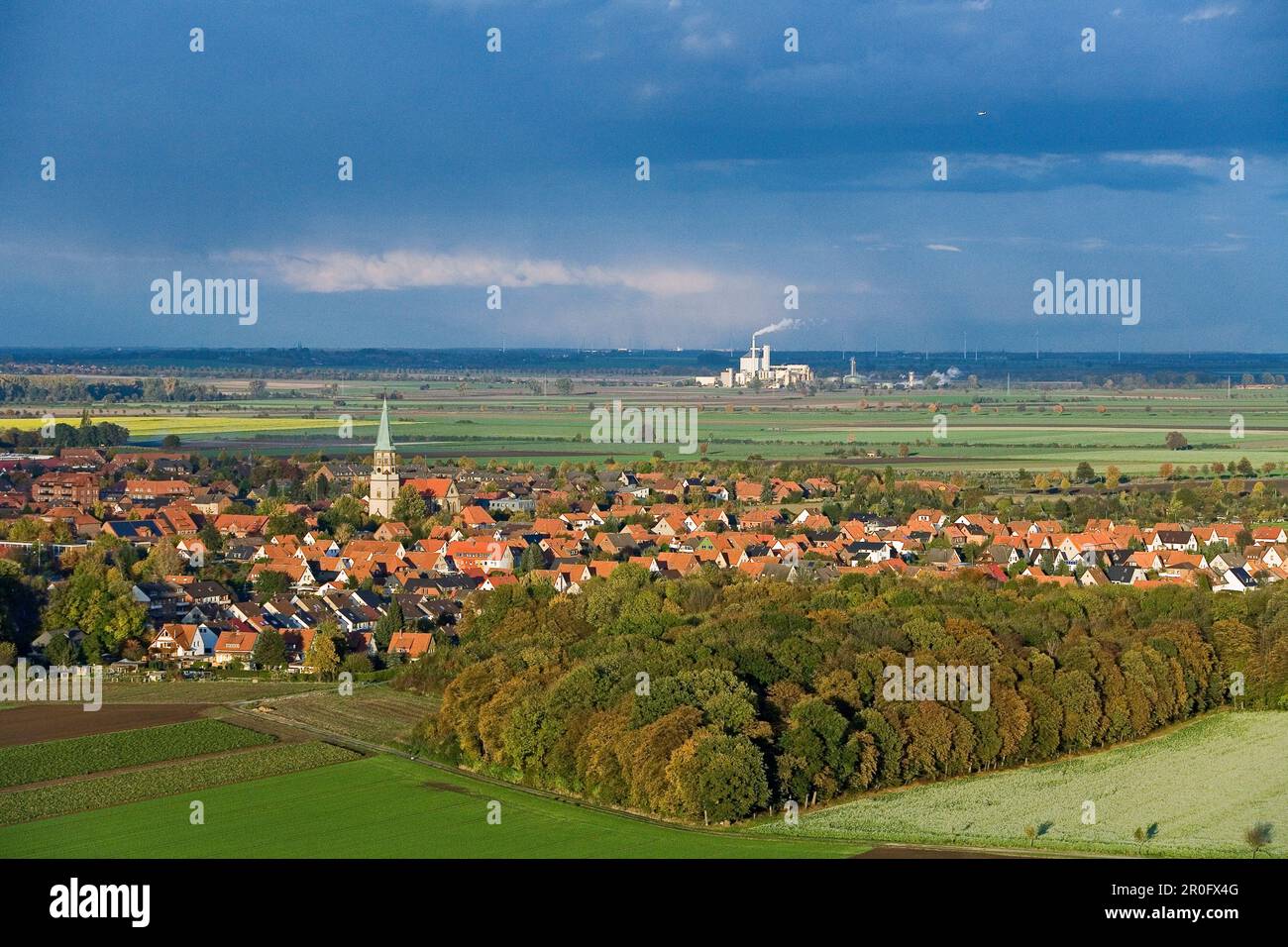 Aerial shot of village near Hanover, factory in background, Lower Saxony, Germany Stock Photo
