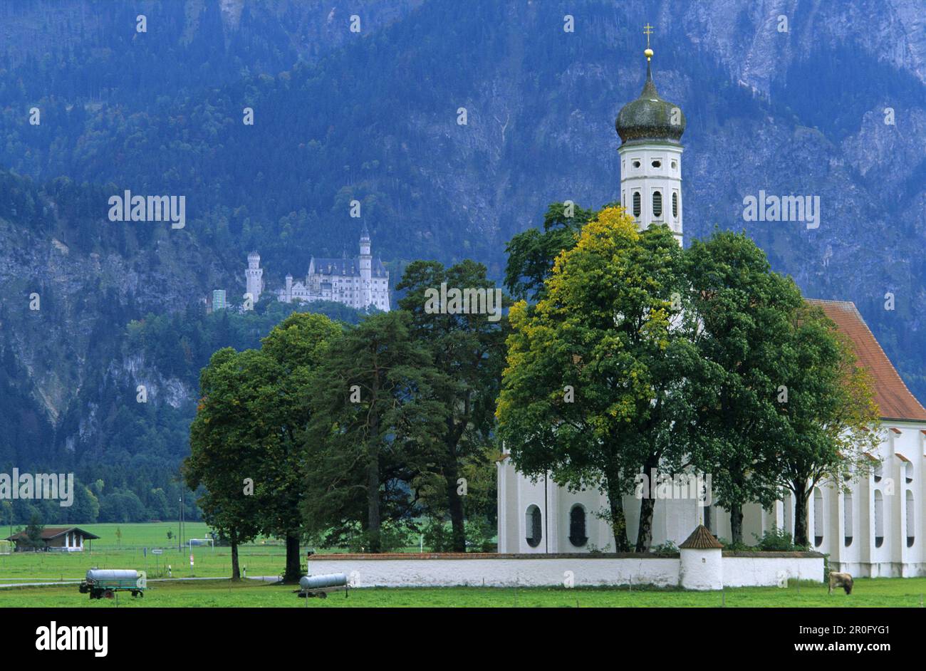 St. Coloman pilgrimage church and Neuschwanstein Castle in background ...