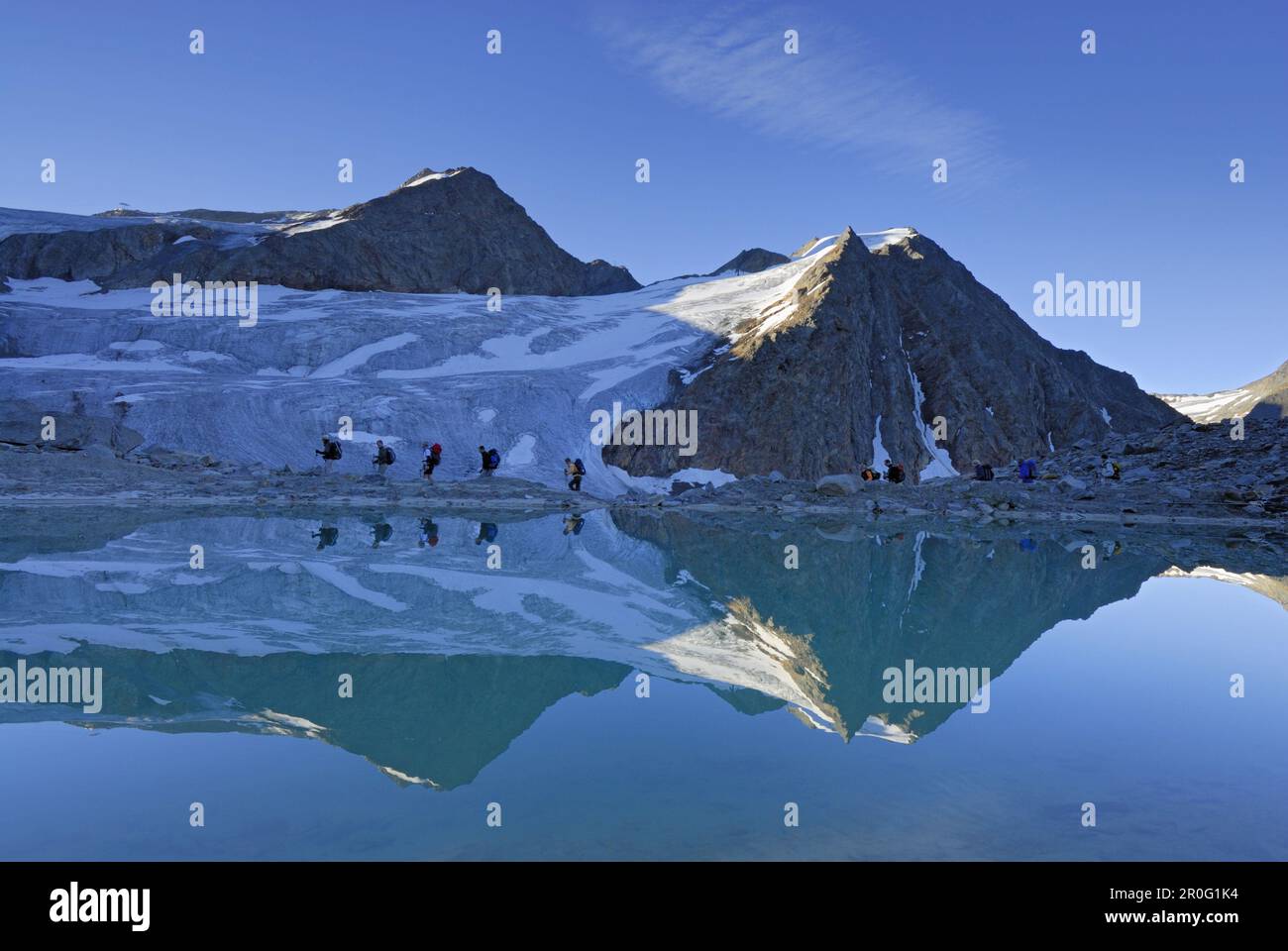 Group of hikers ascending Rettenbachjoch, Oetztal range, Tyrol, Austria Stock Photo