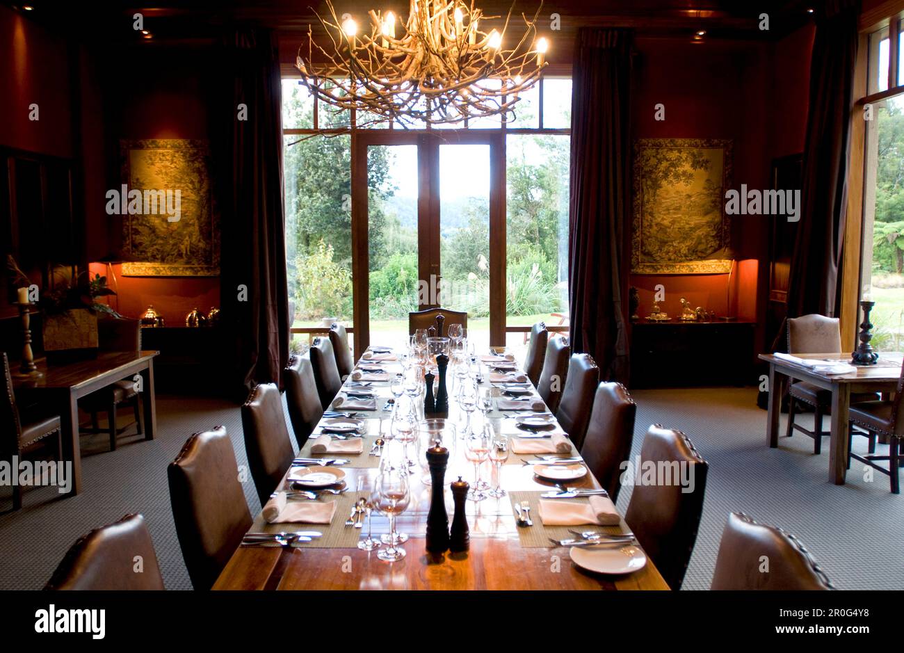 A long table is laid at the deserted dining room of the Treetops Lodge