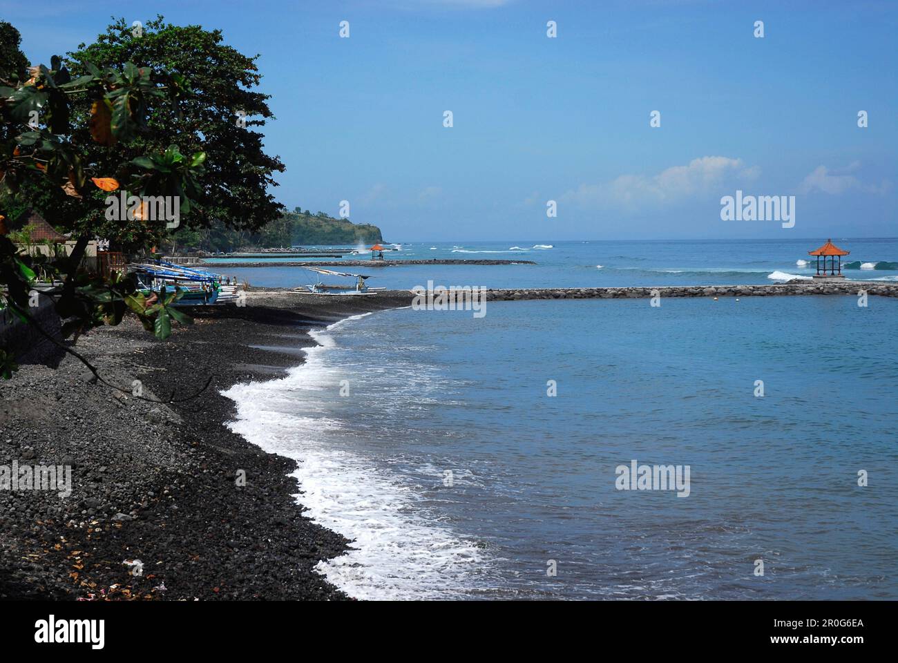 Stony beach at the coast at Candi Dasa, East Bali, Indonesia, Asia Stock Photo