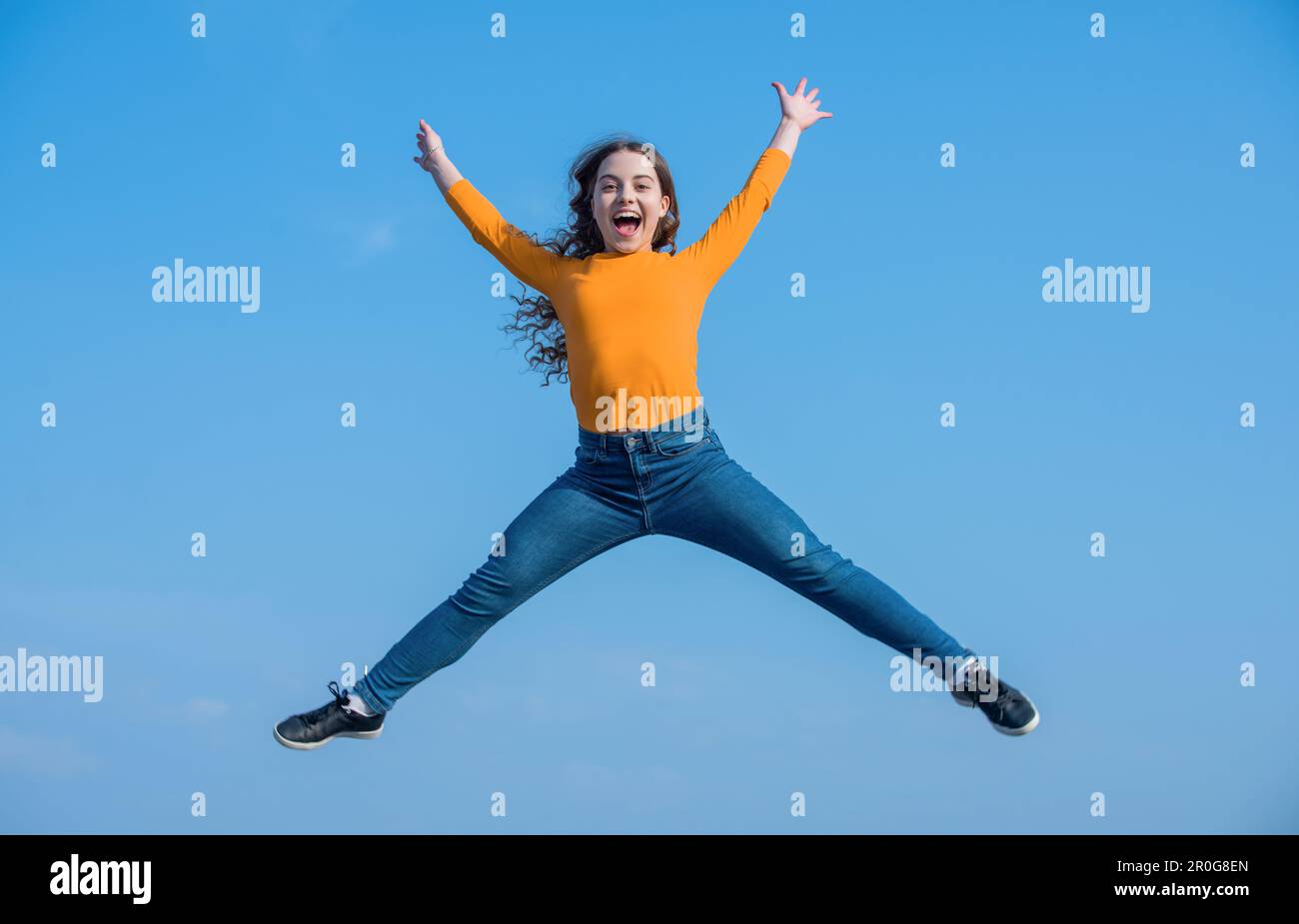 happy teen girl jump high on sky background. happiness Stock Photo - Alamy