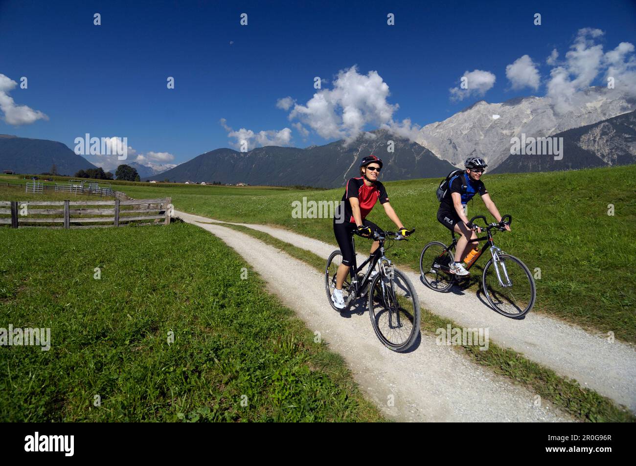 Couple on a mountain bike tour near Obermieming, near Telfs, Mieminger Plateau, Tyrol, Austria Stock Photo