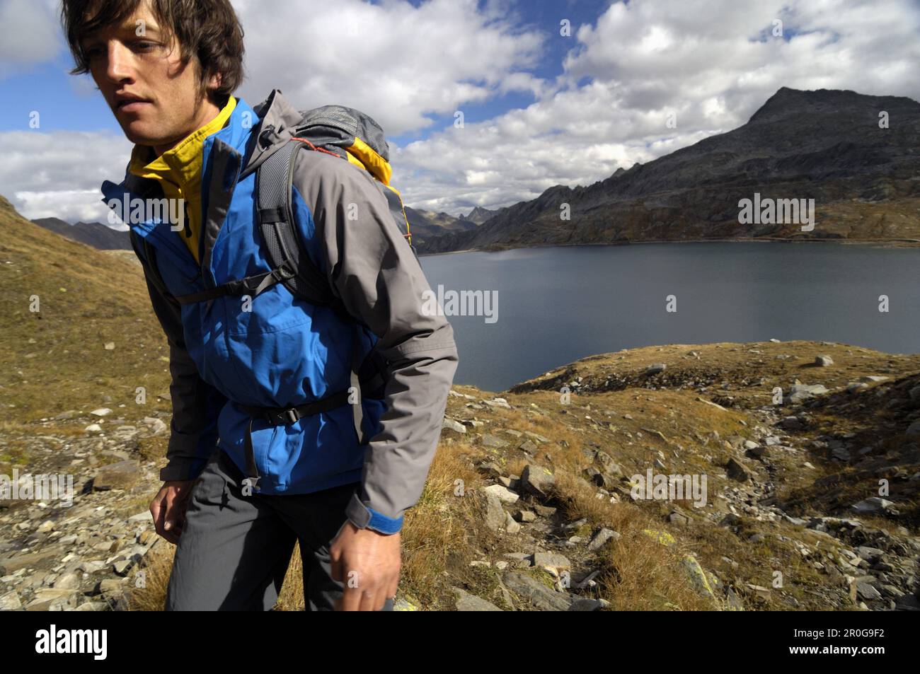 Mountain hiker near Lago del Sambuco, Val Lavizzara, Fusio, Canton of  Ticino, Switzerland Stock Photo