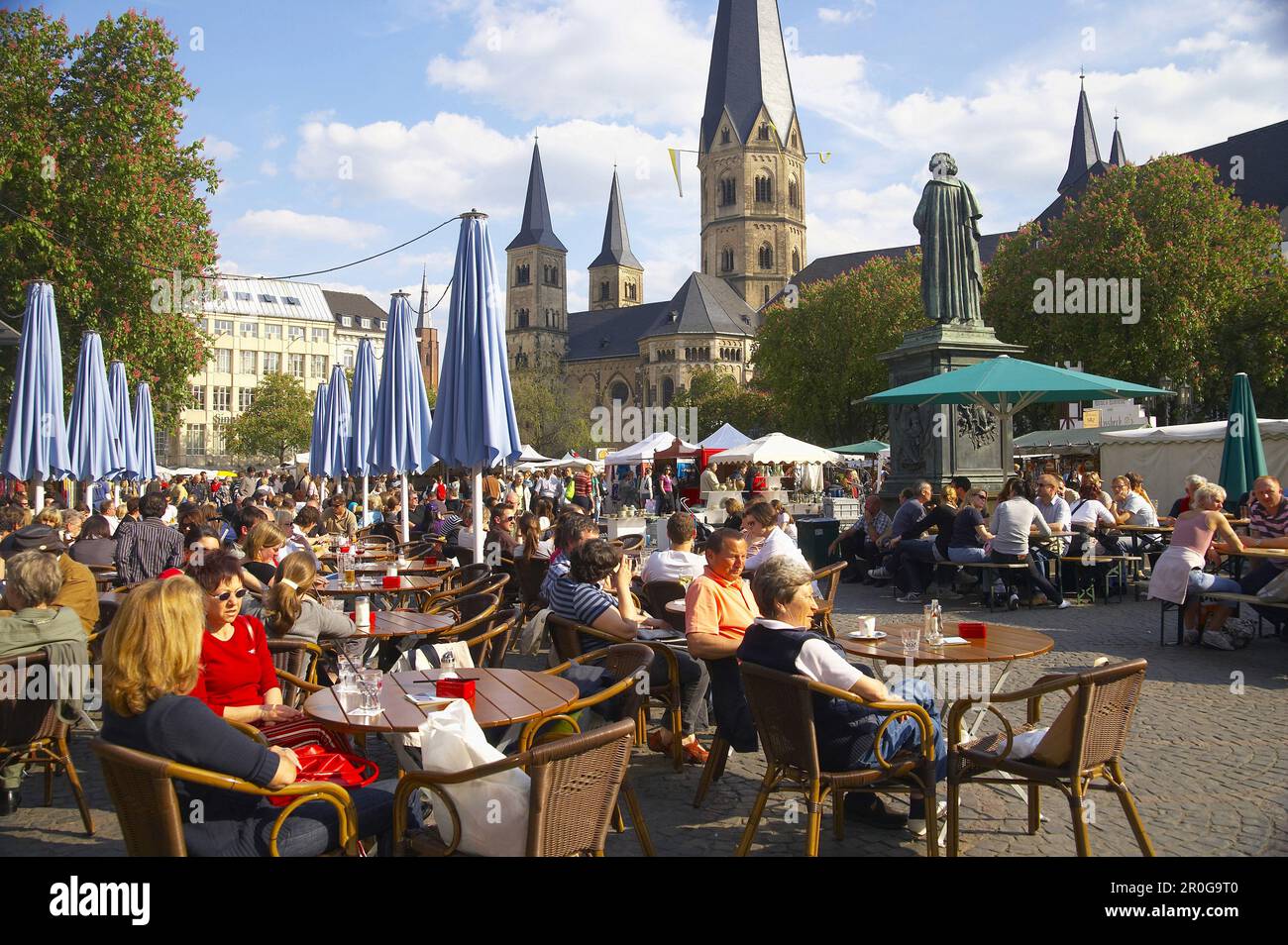 Pavement cafes, Bonn Minster in background, Bonn, North Rhine-Westphalia, Germany Stock Photo