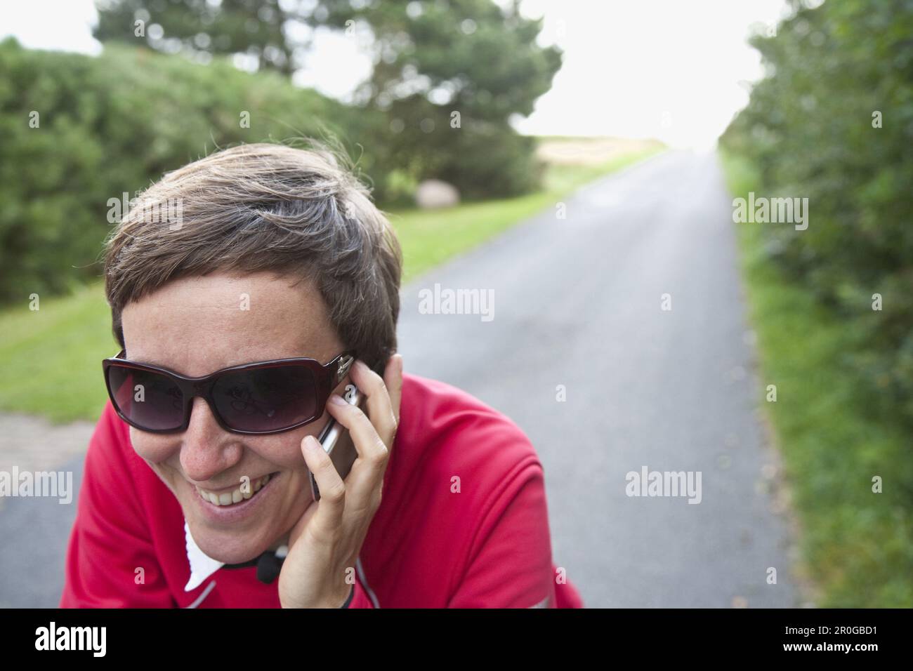 Woman phoning with a mobile phone, Utersum, Foehr island, Schleswig