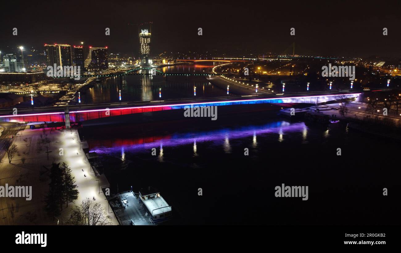 An aerial view of the Belgrade Branko bridge illuminated by streetlights at night time Stock Photo