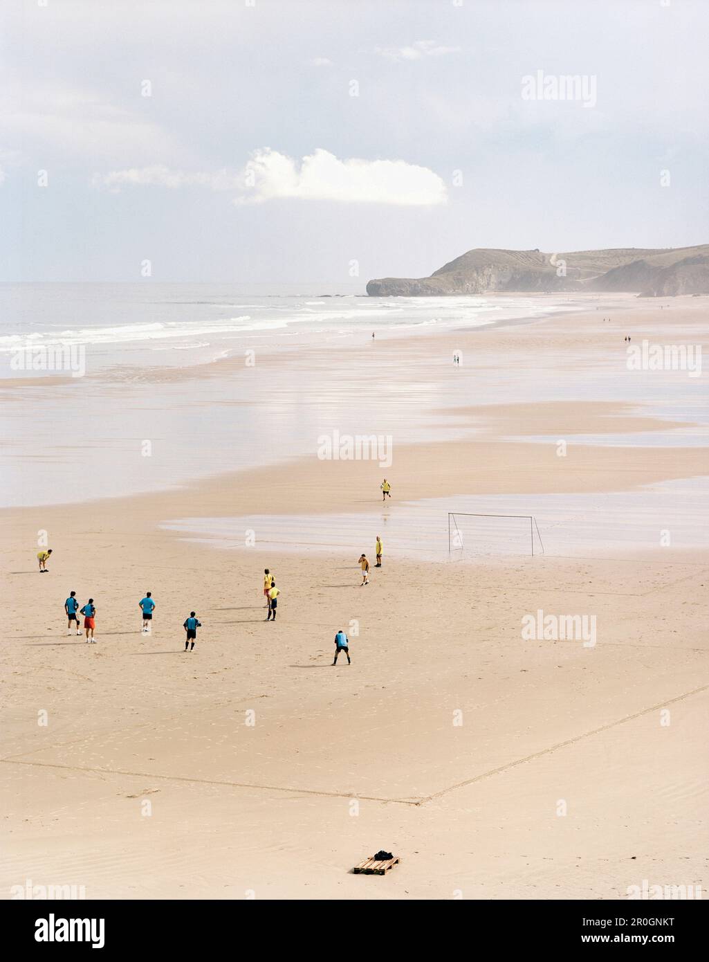 People playing soccer at beach, Playa de Meron, San Vicente de la Barquera, Parque Natural de Oyambre, Cantabria, Spain Stock Photo
