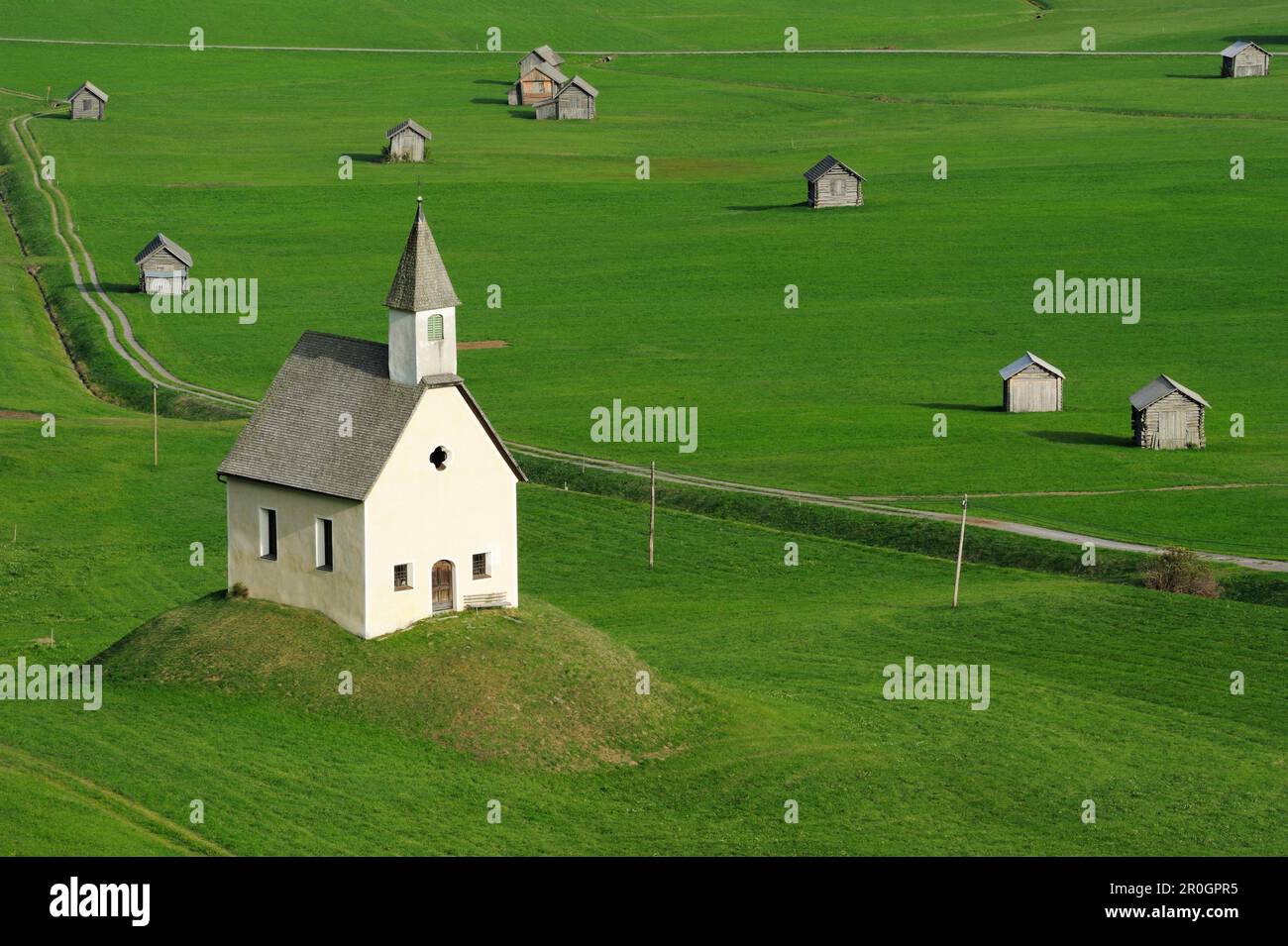 Chapel and hay sheds in meadow, valley of Lesachtal, Carinthia, Austria, Europe Stock Photo