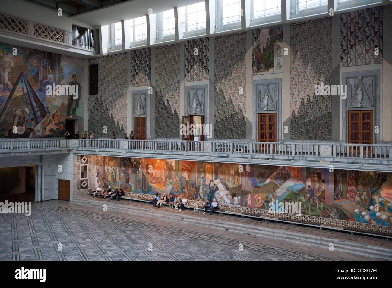 Interior view of Oslo Radhus, city hall with large mural paintings ...