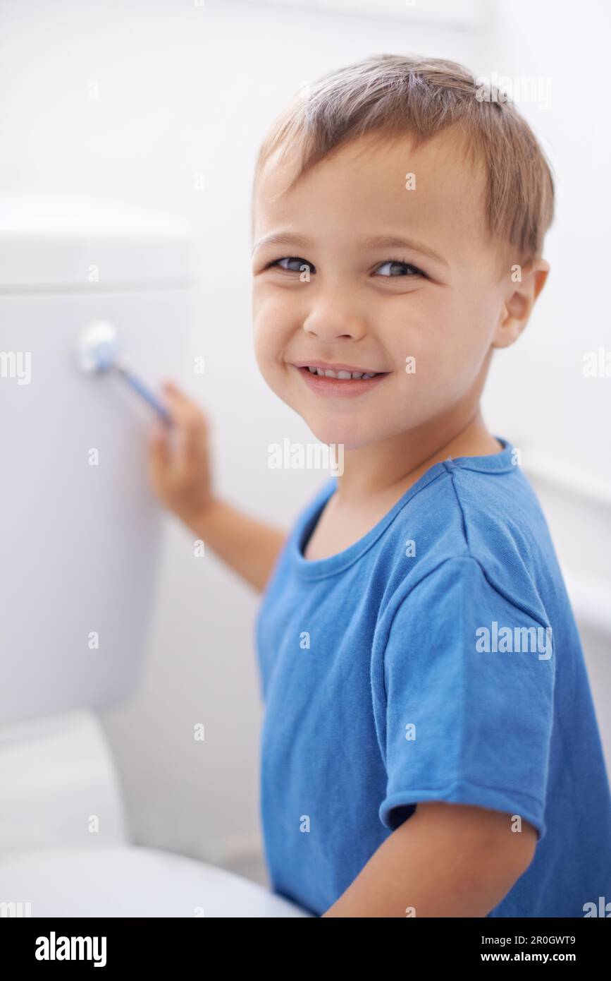 Flushing away moms potty training worries. Portrait of a cute young boy
