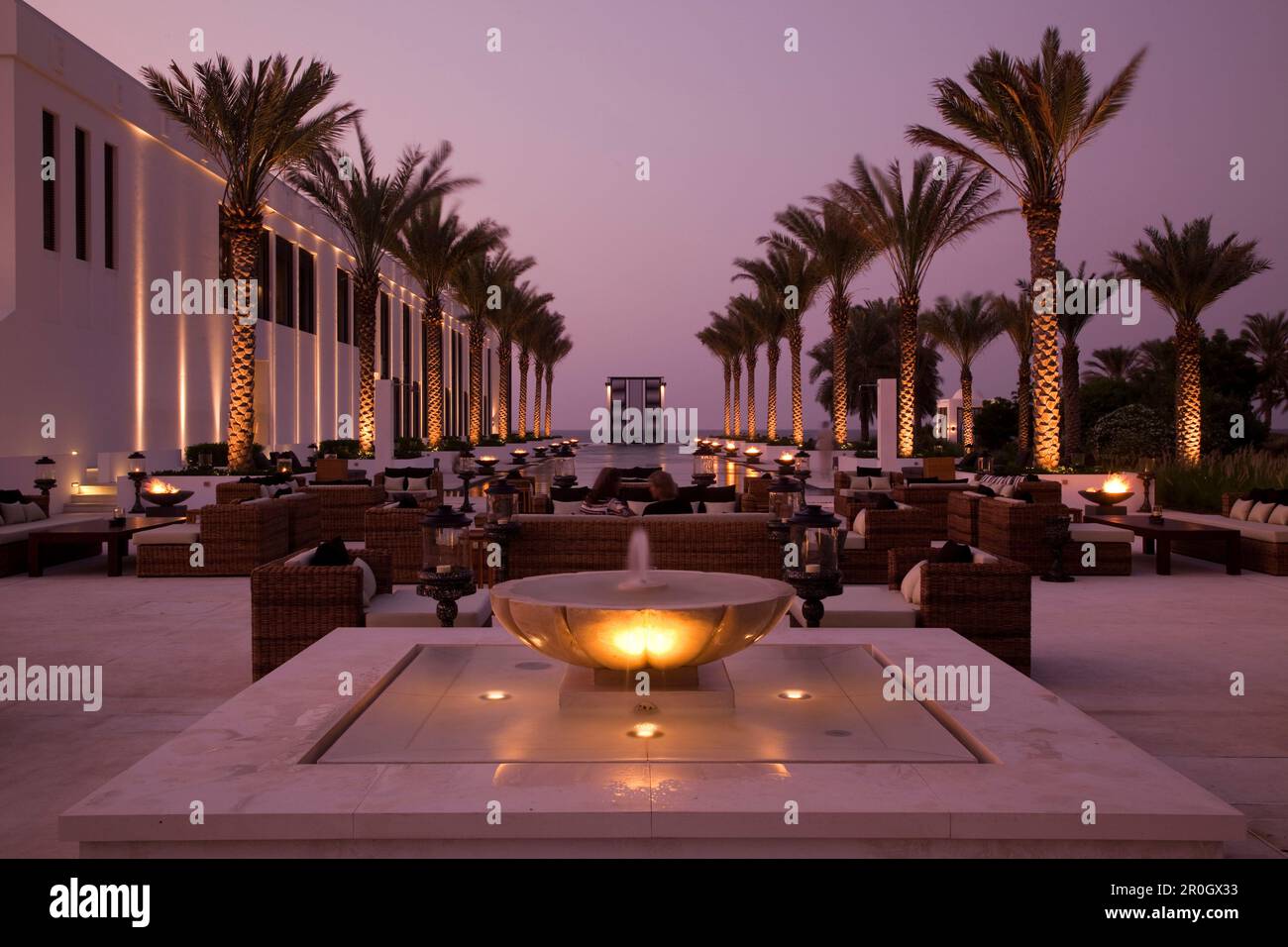 The Long Pool, The Chedi Muscat hotel at dusk, Muscat, Masqat, Oman, Arabian Peninsula Stock Photo