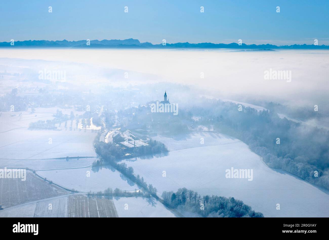 Aerial shot of Andechs Abbey with Wetterstein mountain range, Ester mountains and Karwendel mountains in background, Upper Bavaria, Germany Stock Photo