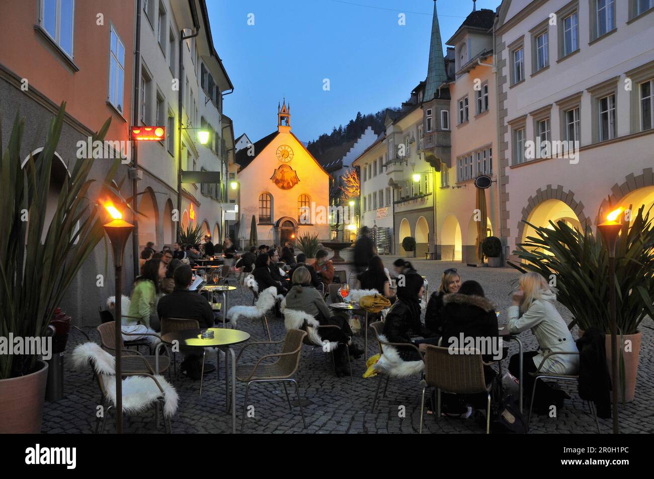 People in street cafes in the street Marktstrasse in the evening, Feldkirch, Vorarlberg, Austria, Europe Stock Photo