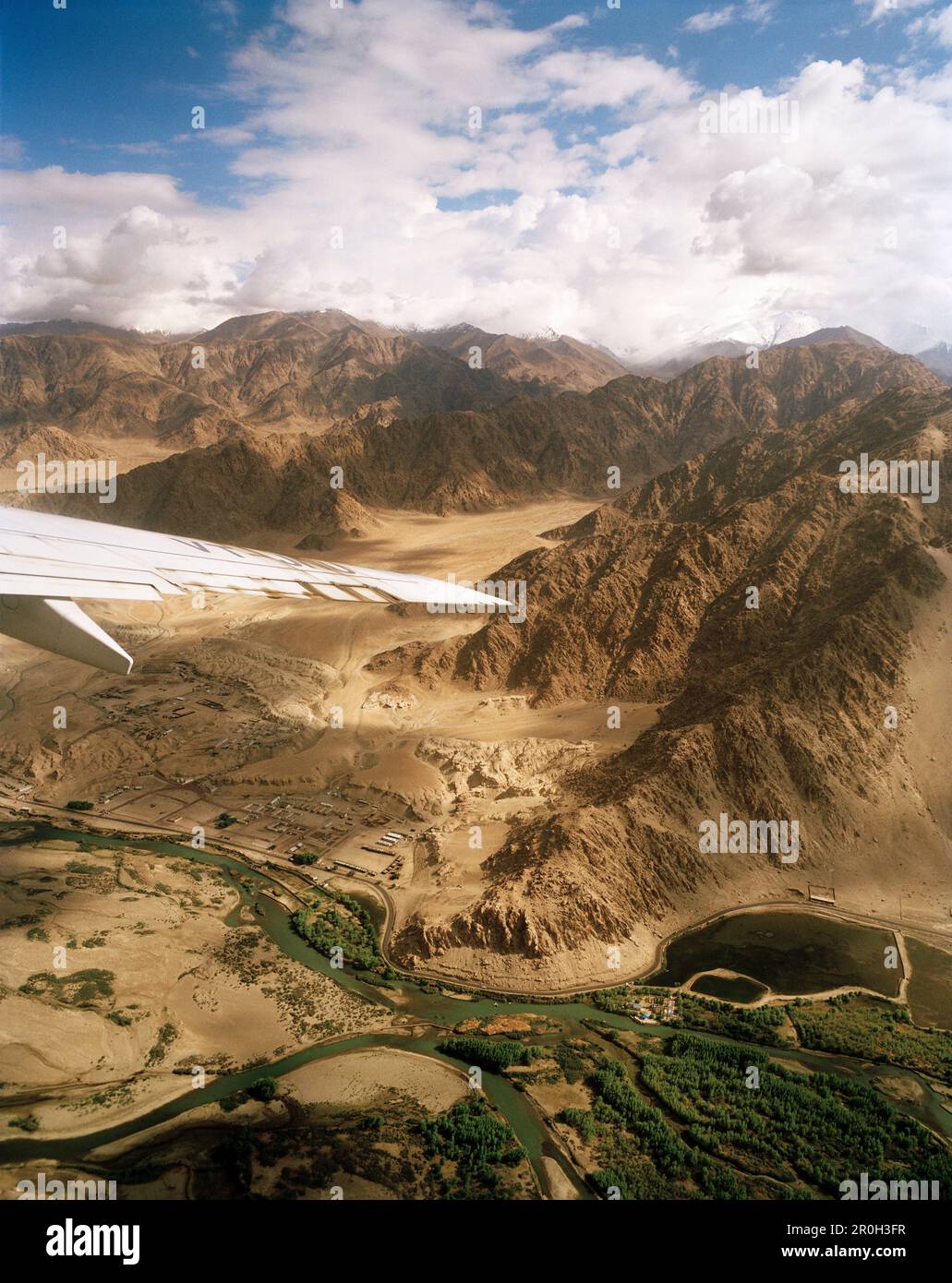 View from a jet, approach to capital city Leh via the Indus valley ahead Karakorum Range, Ladakh, Jammu and Kashmir, India Stock Photo