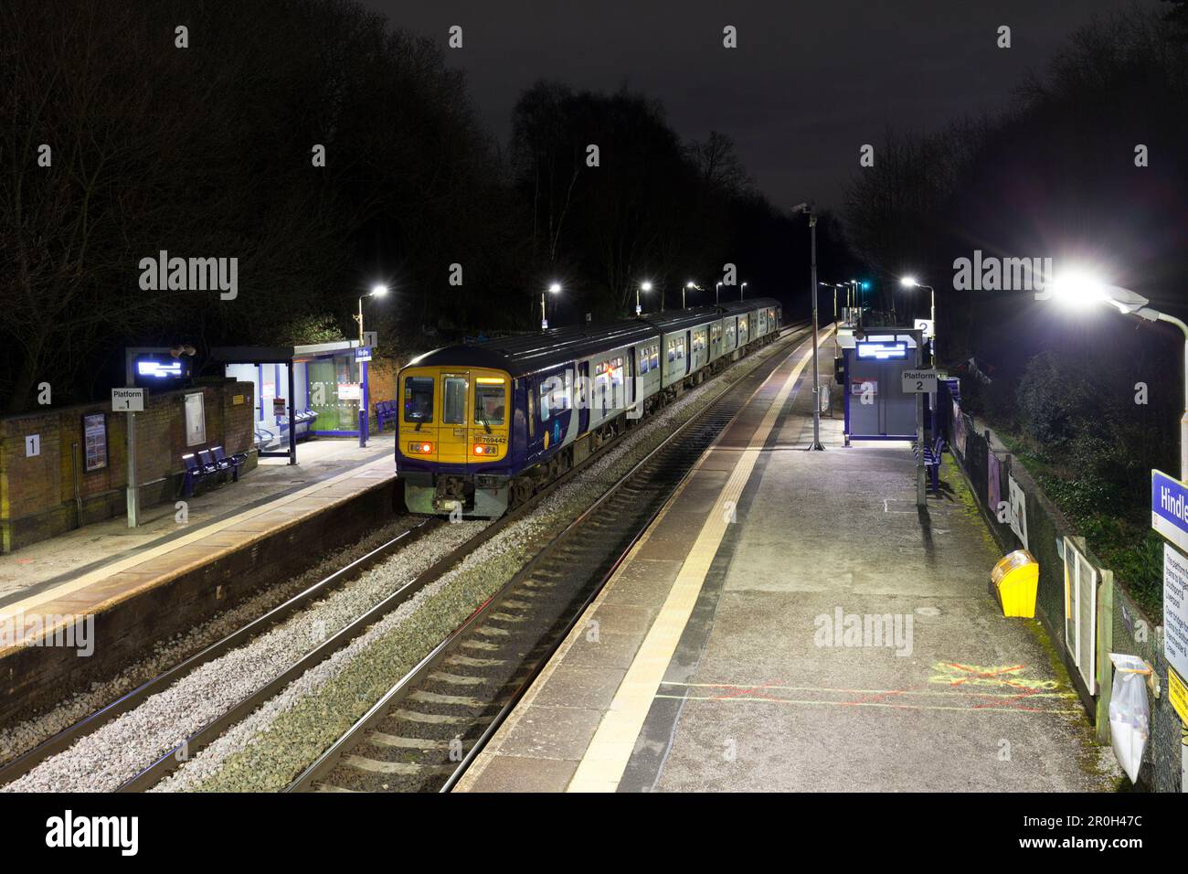 Northern Rail class 769 bi mode flex train 769448 calling at Hindley