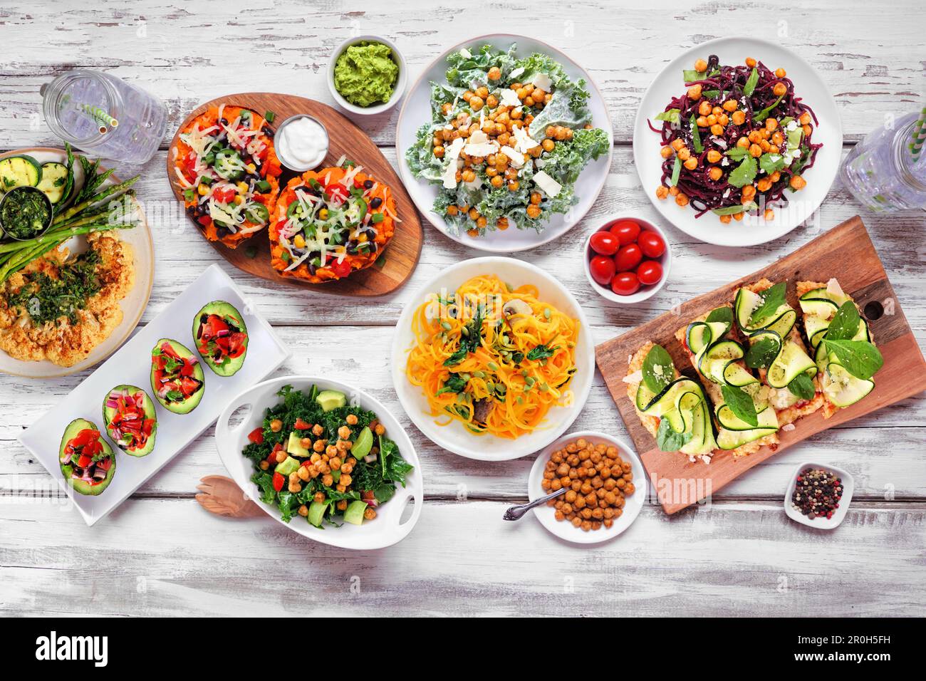 Healthy plant based low carb food table scene. Top down view on a white