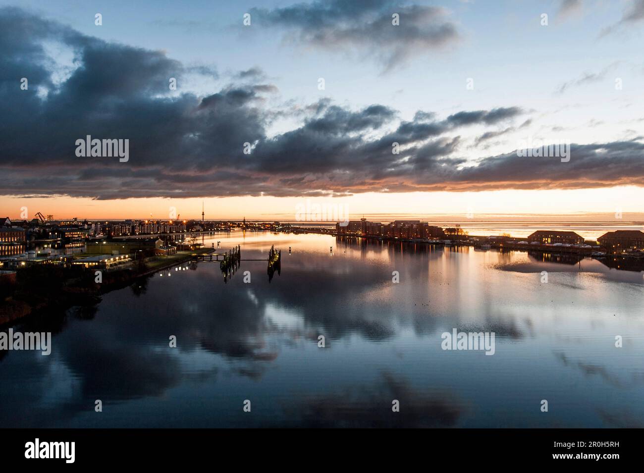 View to the city of Wilhelmshaven and sunrise over the Jadebusen, Wilhelmshaven, Niedersachsen, North Sea, Germany Stock Photo