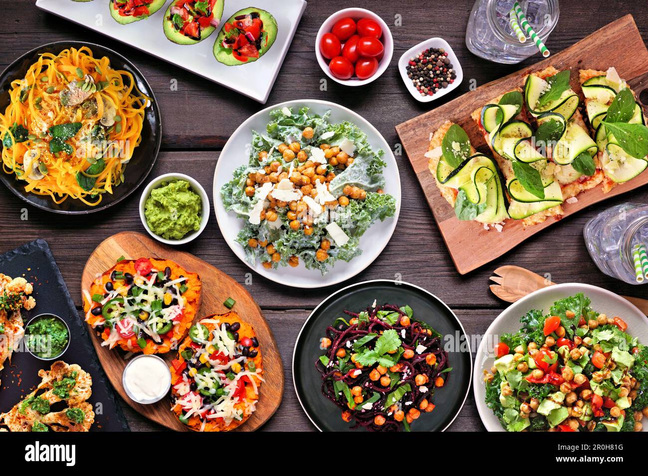 Healthy plant based, low carb diet table scene. Overhead view on a dark