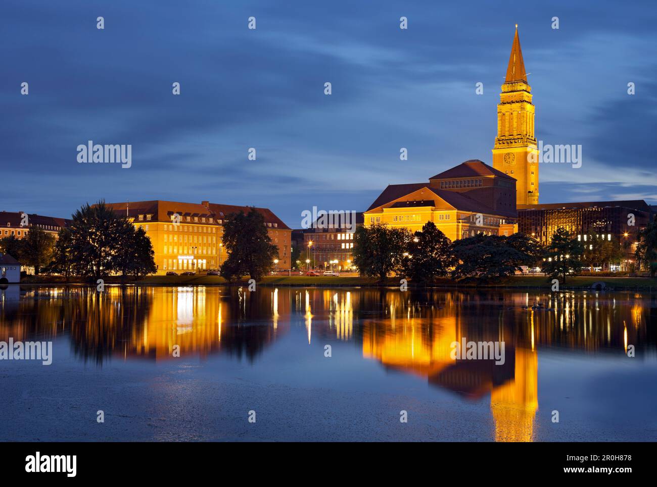 Town hall and opera house at night, Reflection in the water, Kleiner Kiel, Kiel, Schleswig-Holstein, Germany Stock Photo