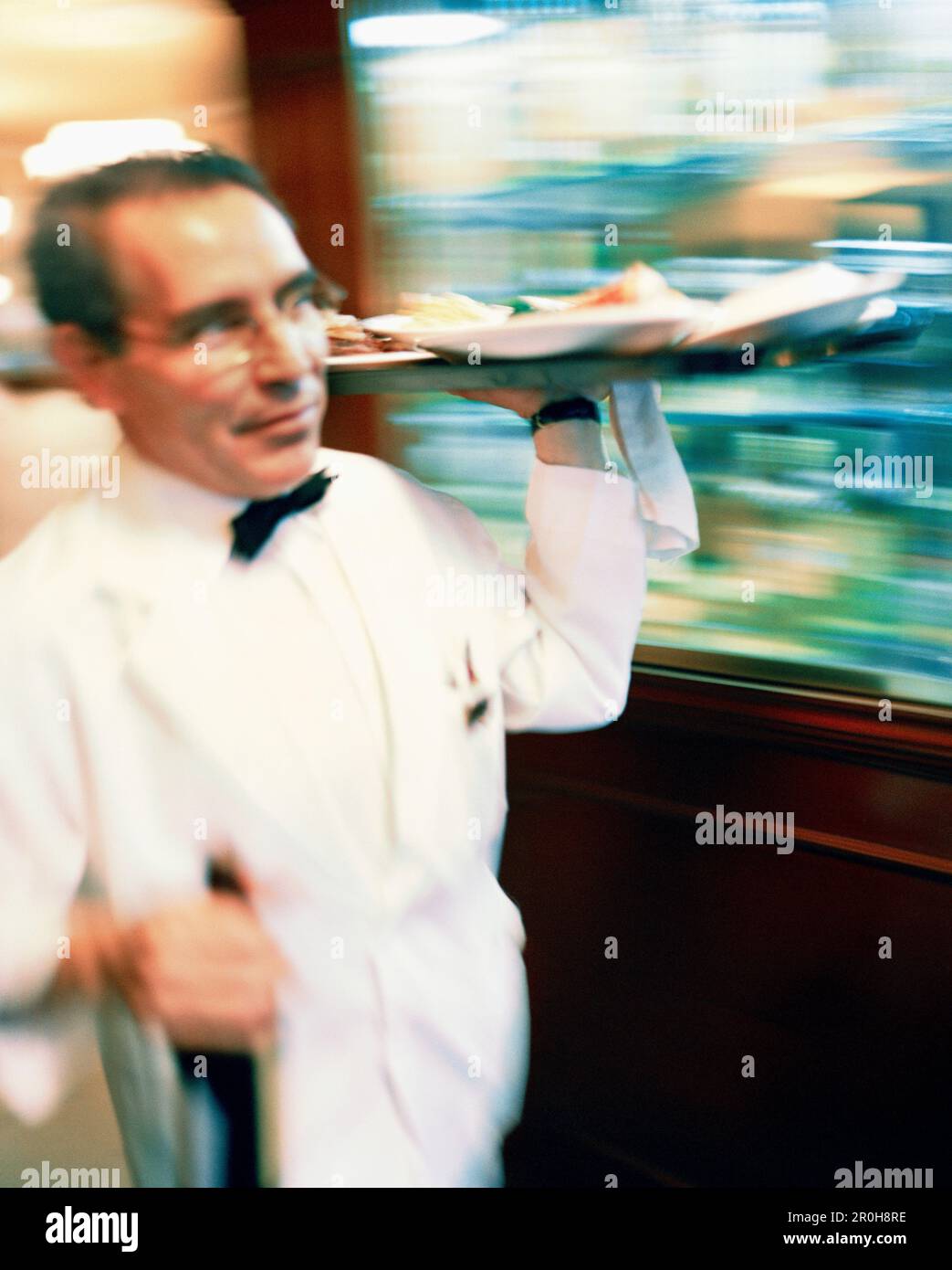 Waiter carrying tray hi-res stock photography and images - Alamy