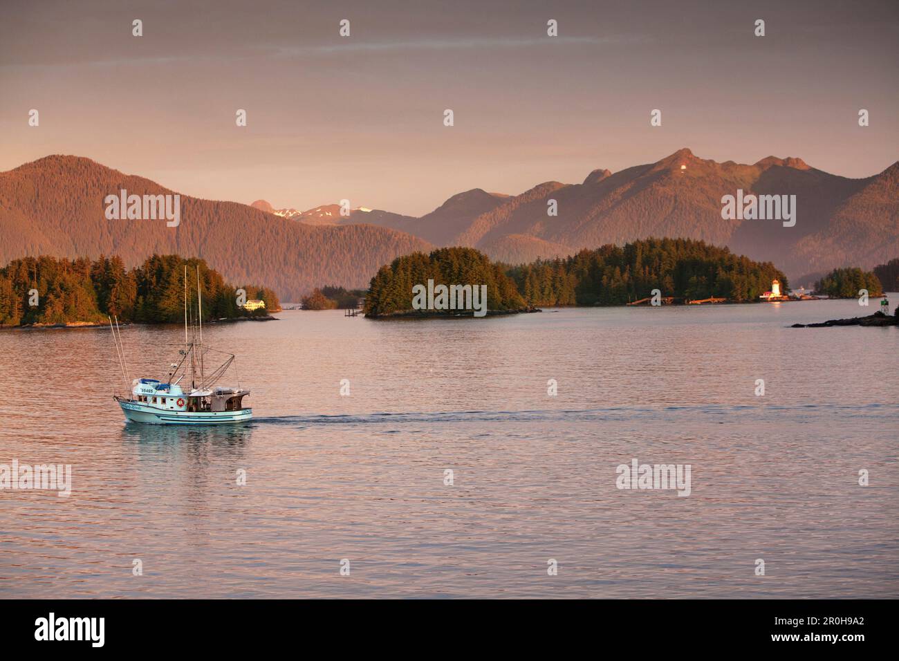 ALASKA, Sitka, a fishing boat makes it's way to the Sitka Harbor