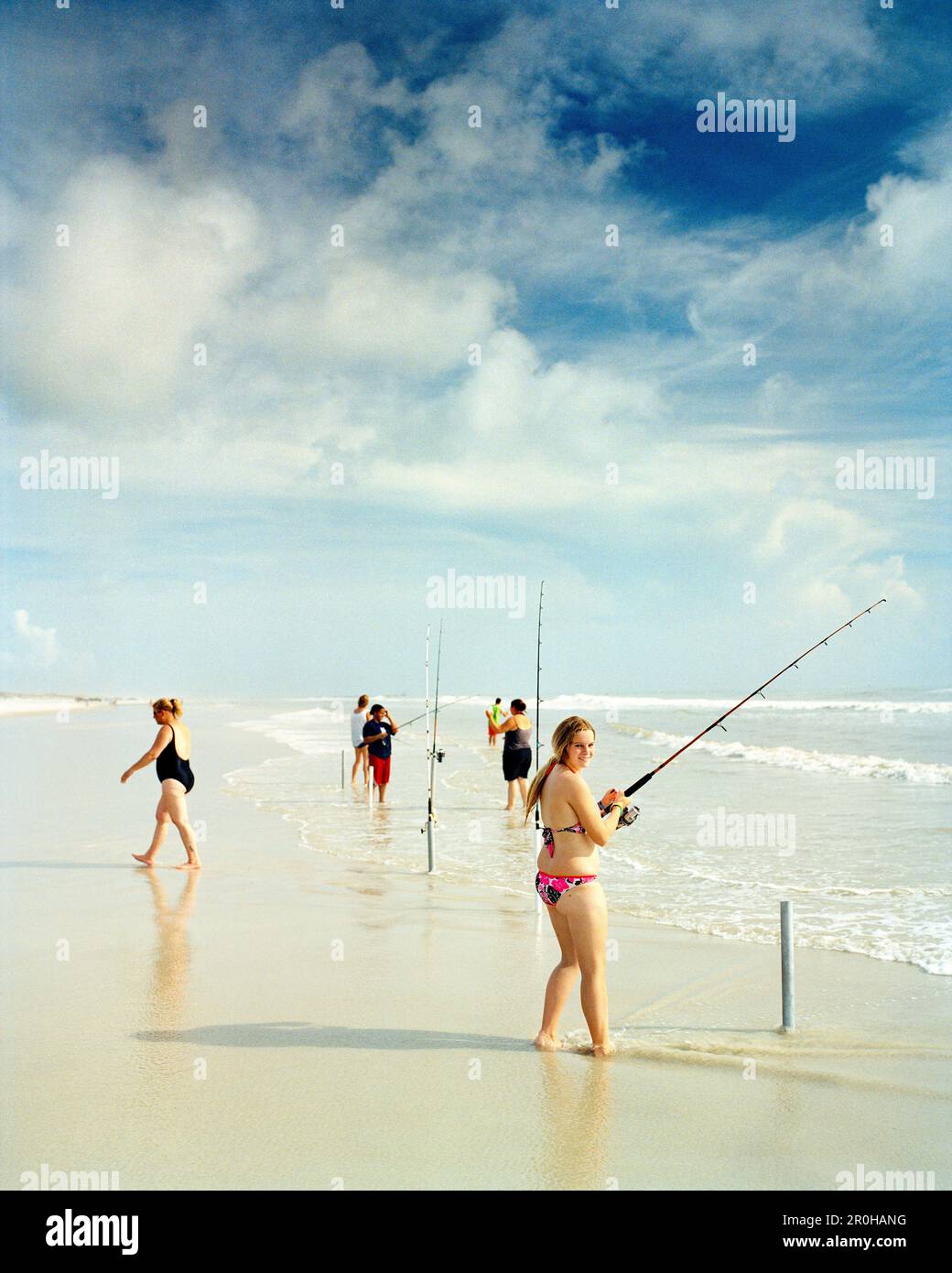 USA, Florida, women fishing on beach, New Smyrna Beach Stock Photo