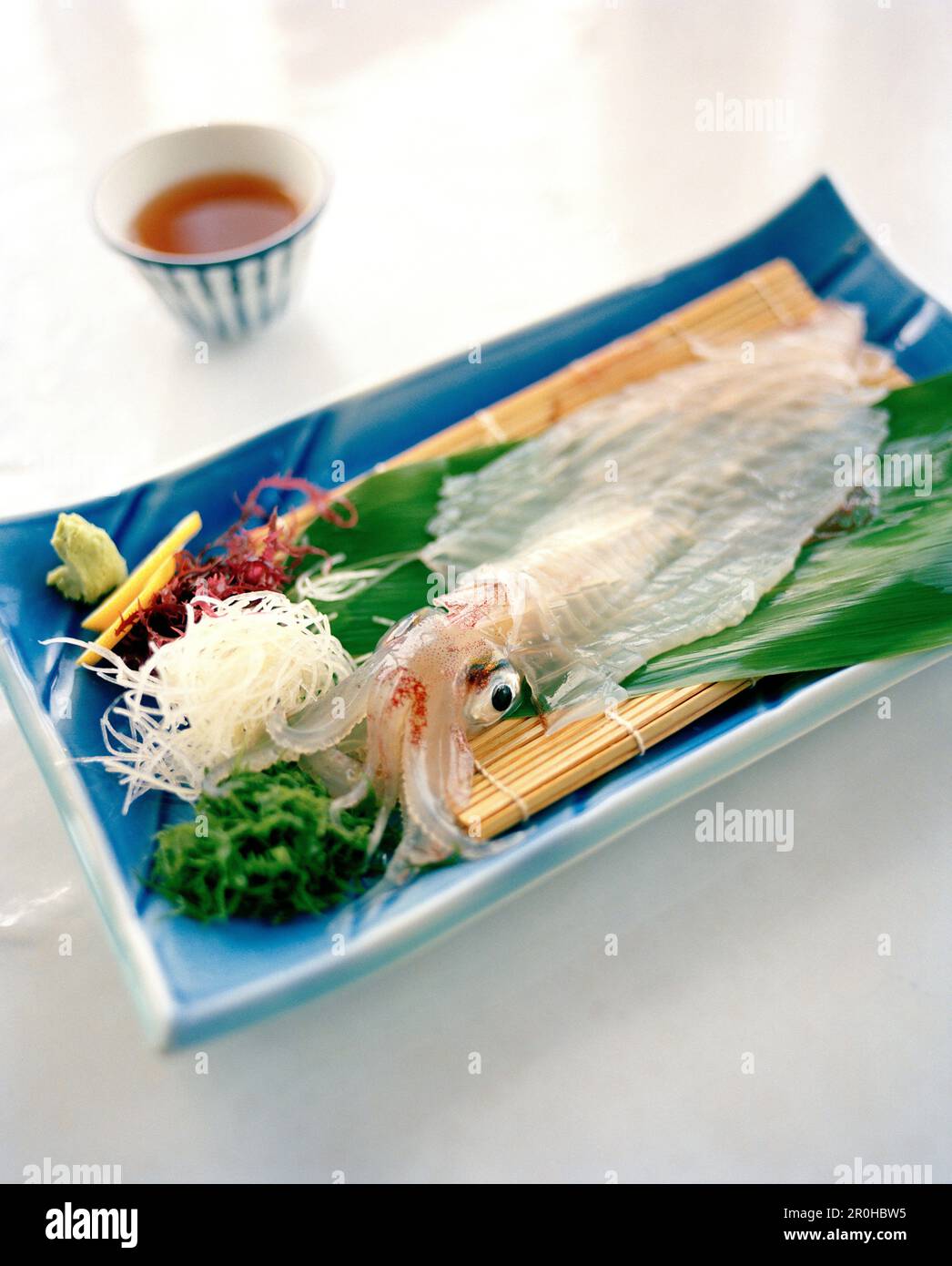 JAPAN, Kyushu, live squid served on Karatsu Pottery, Kai Shu Restaurant Stock Photo