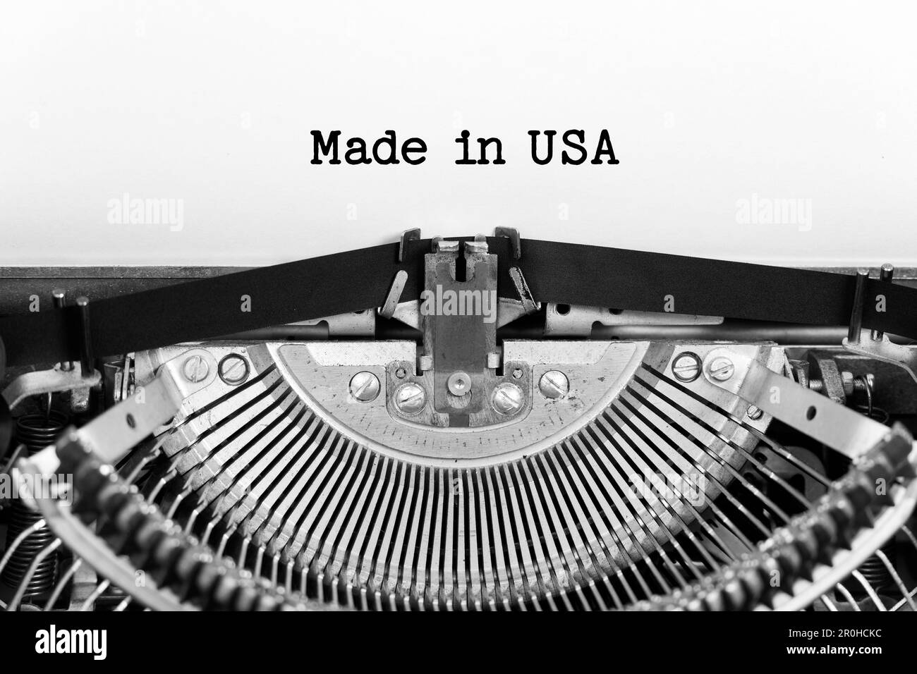 Made In Usa phrase closeup being typing and centered on a sheet of paper on old vintage typewriter mechanical Stock Photo