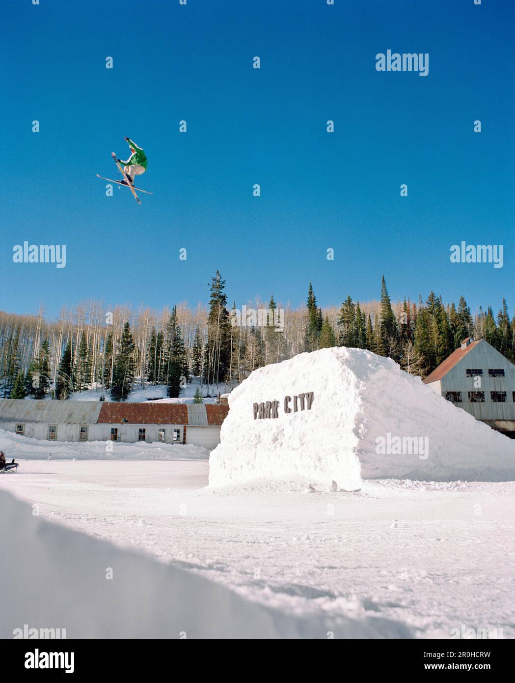 USA, Utah, male skier in midair gap jump, Park City Ski Resort Stock Photo