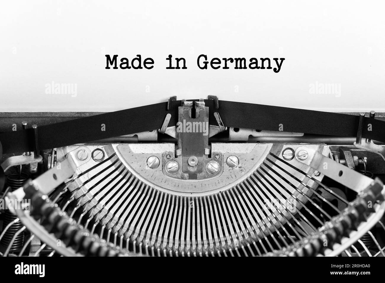 Made In Germany phrase closeup being typing and centered on a sheet of paper on old vintage typewriter mechanical Stock Photo