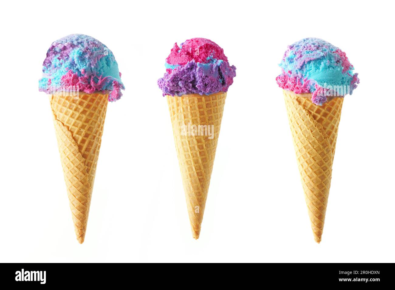 Three cotton candy flavored ice cream cones isolated on a white background. Pink, blue and purple color. Stock Photo