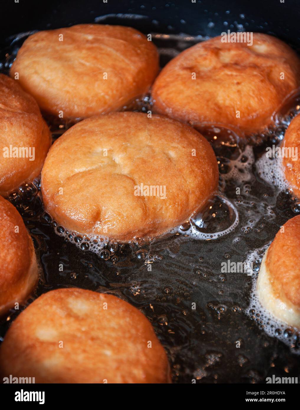 Traditional homemade polish donuts. Oil frying process Stock Photo Alamy