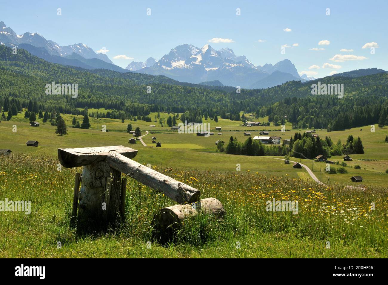 View across meadows towards the Wetterstein mountain range, Karwendel mountain range near Mittenwald, Bavaria, Germany Stock Photo