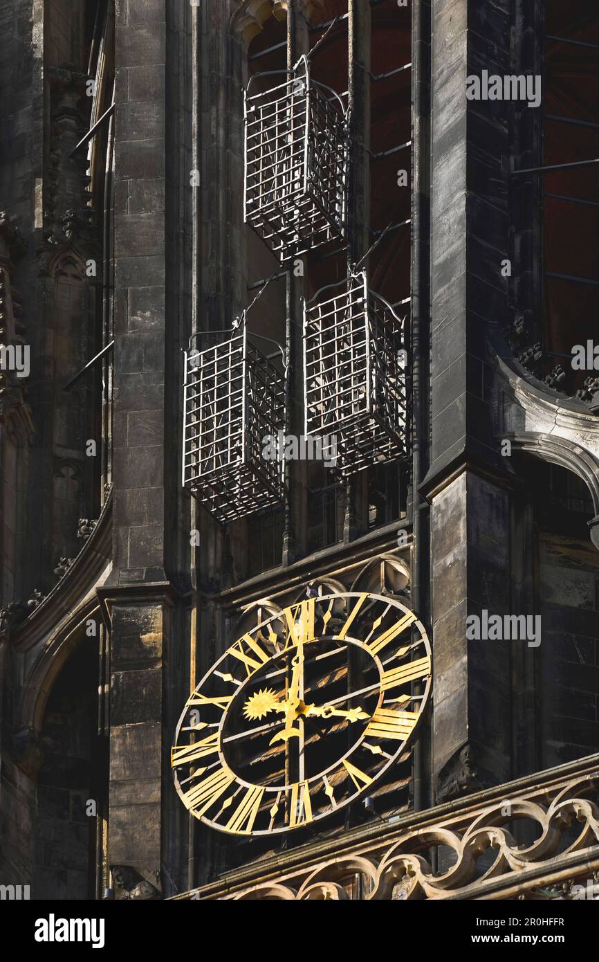 original cages at the tower of St Lambert's Church with clock, Germany