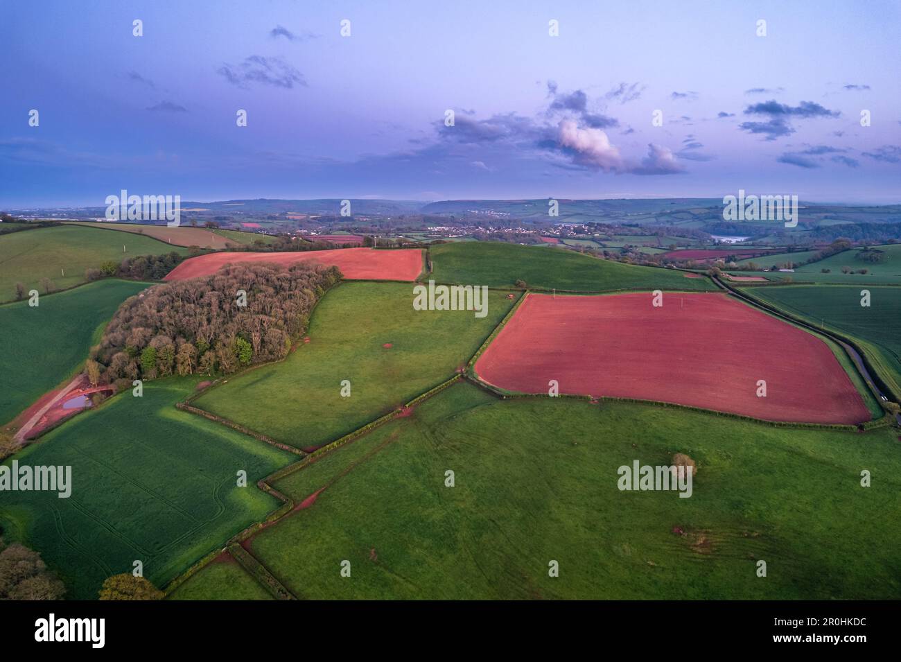 Sunset over Fields and Farmlands in spring from a drone, Devon, England ...