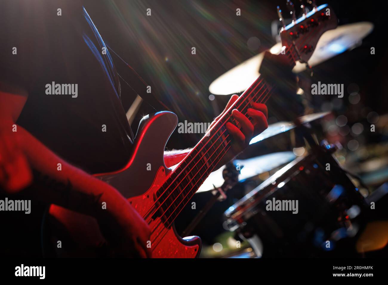 Bass player's fingers on the guitar fretboard closeup Stock Photo Alamy