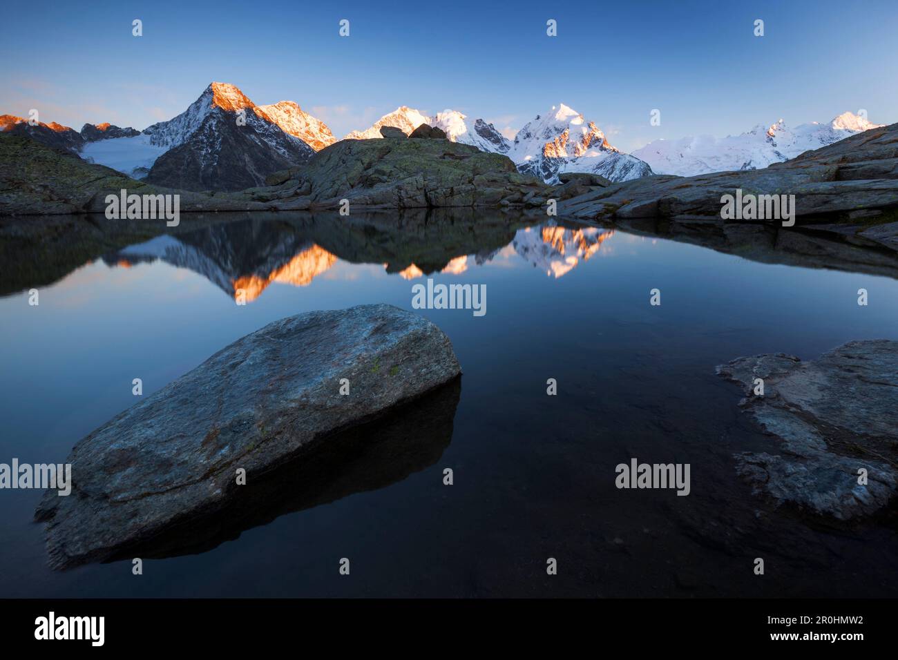 Alpenglow on the peaks of Bernina Range, Val Roseg, Engadin, Canton of Grisons, Switzerland Stock Photo