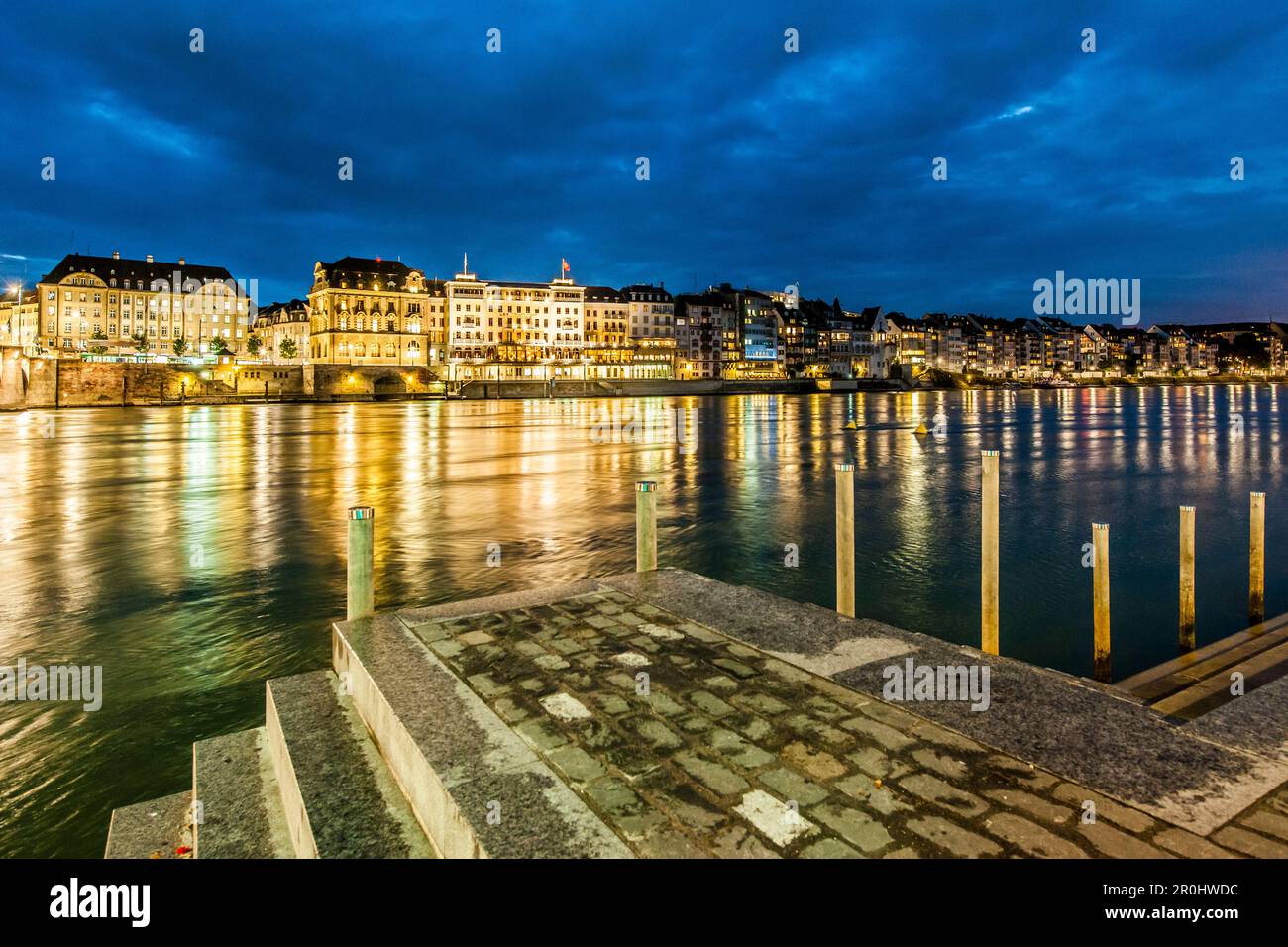 View over the river Rhine to a hotel in the evening, Basel, Canton of Basel-Stadt, Switzerland Stock Photo