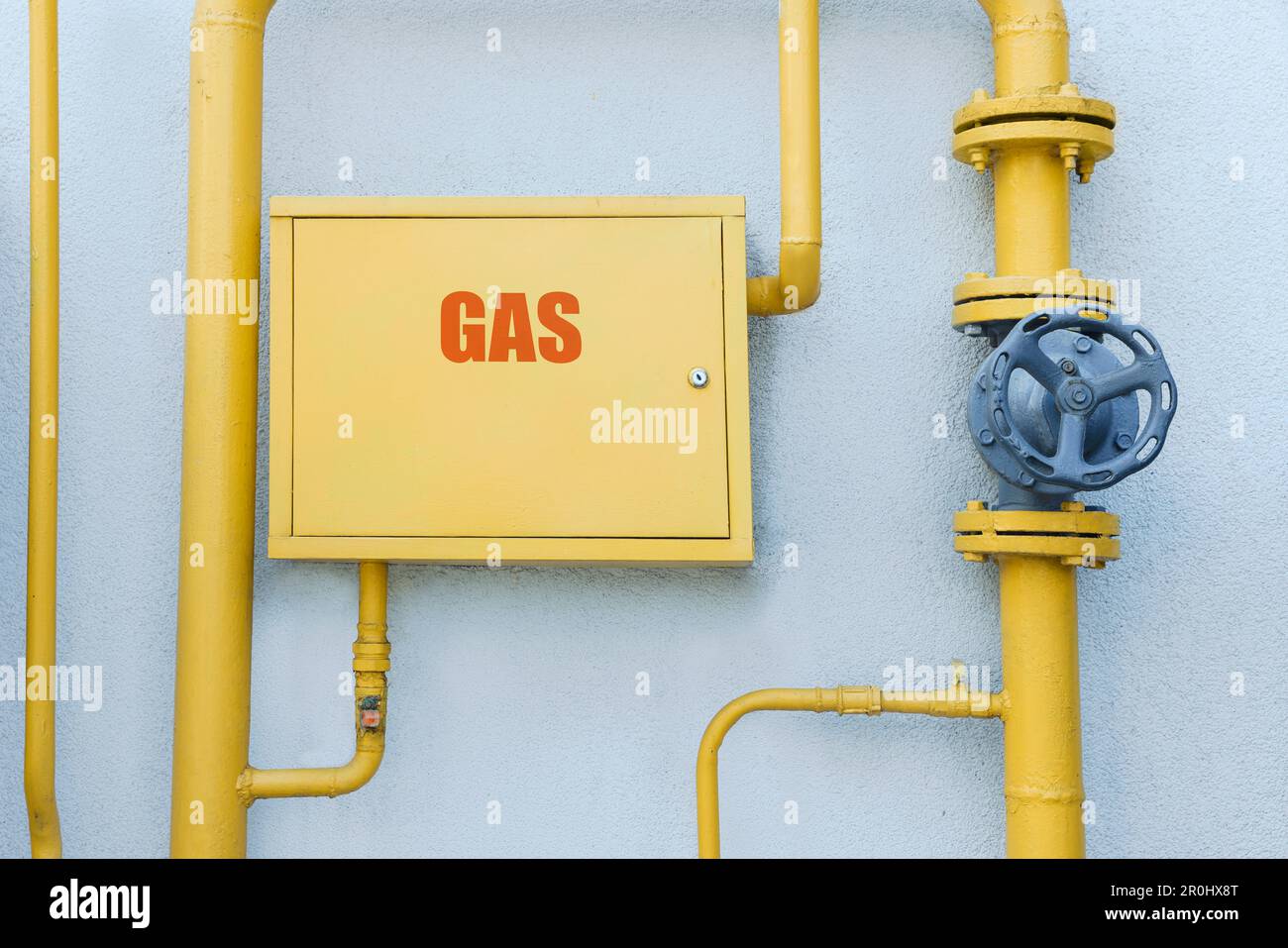 Gas meter box and pipes near grey wall outdoors Stock Photo Alamy